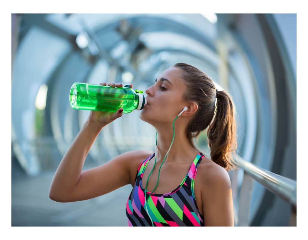 woman drinking water exercise healthy