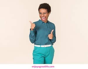 woman with thumbs up looking happy