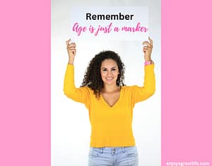 lady holding sign up age is just a marker