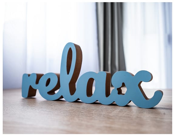 relax words wooden sign