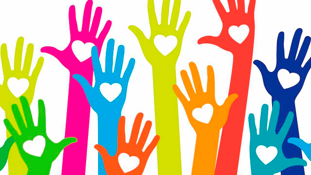 colourful hands in the air with hearts for kindness