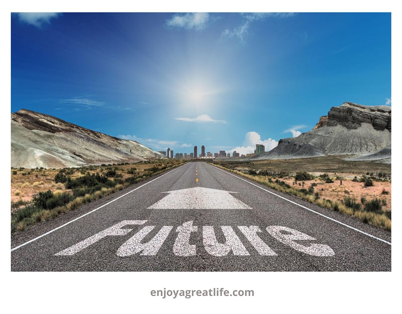 the word future and an arrow marked on a road in a rural landscape