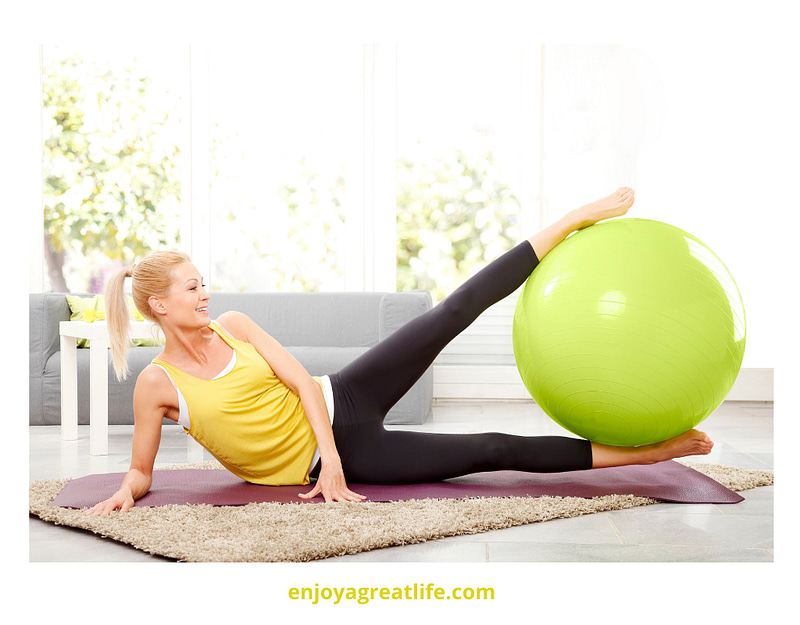 woman exercising with a fitness ball