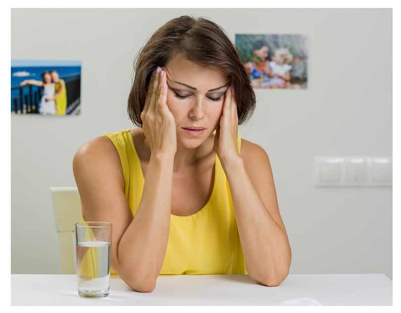 woman head in hands stressed