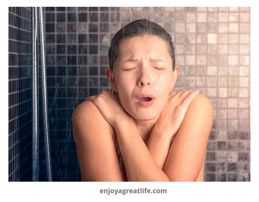woman having freezing cold shower