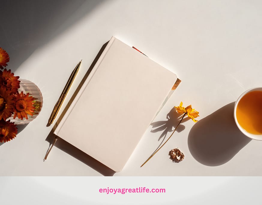 journal pen and cup of tea on a kitchen table