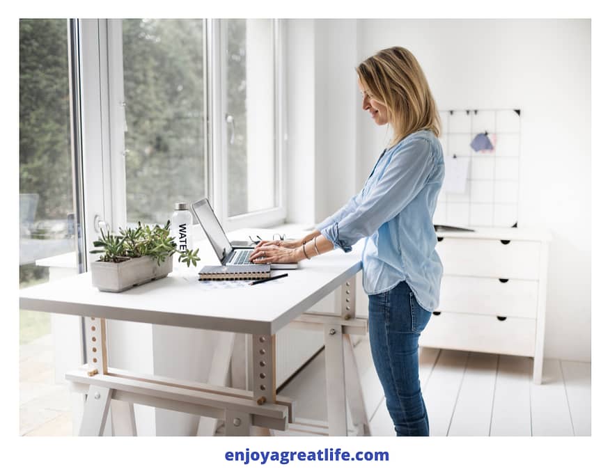 woman stood at stand up desk working