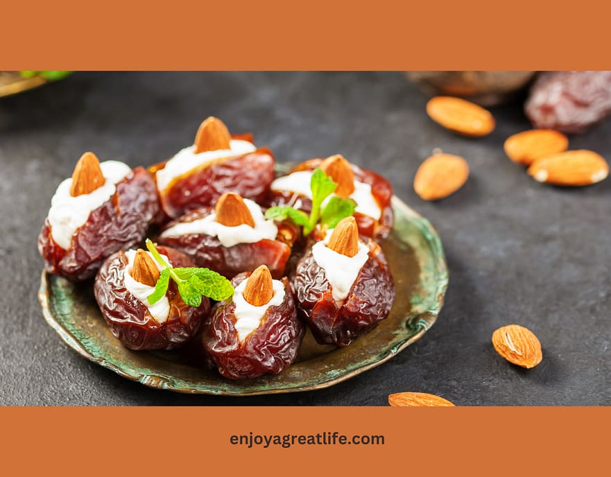 medjool dates filled with cream cheese and topped with an almond
