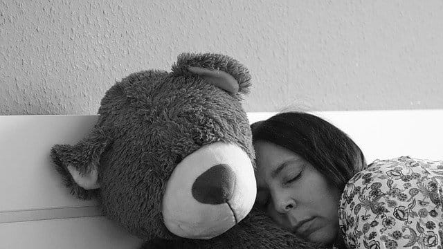 can't sleep woman with teddy bear life coaching